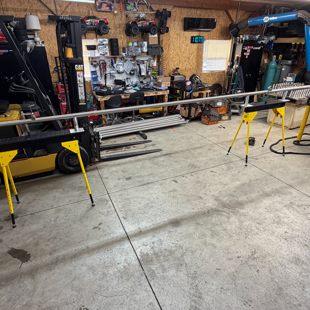Extended weldment supported with adjustable sawhorses